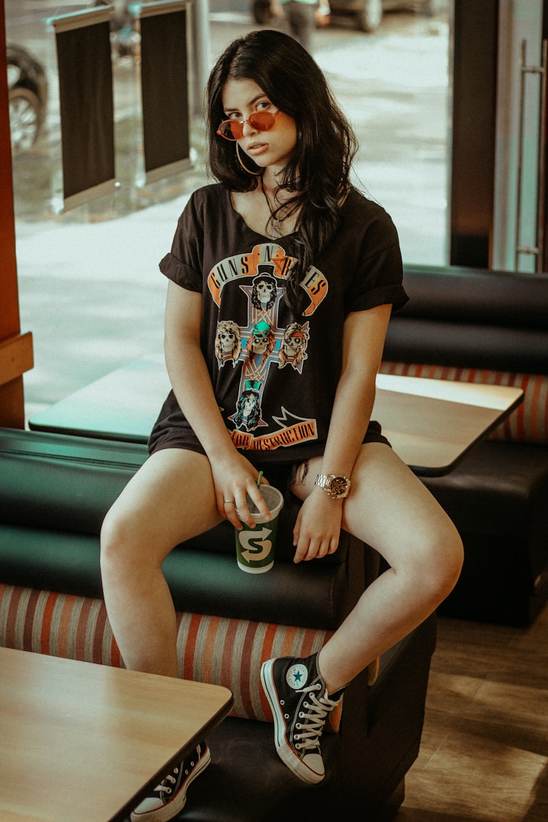 Photo by Allef Vinicius woman sitting on sofa inside room