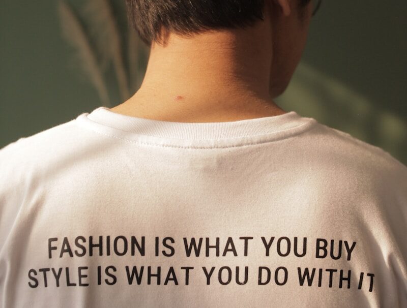Photo by jagadshd man in white crew neck shirt with black and green sunglasses