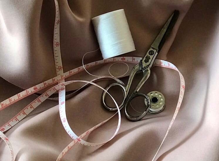 Photo by pina messina white tape measure and gray scissors